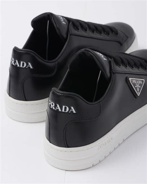 prada black and white trainers|men's black prada trainers.